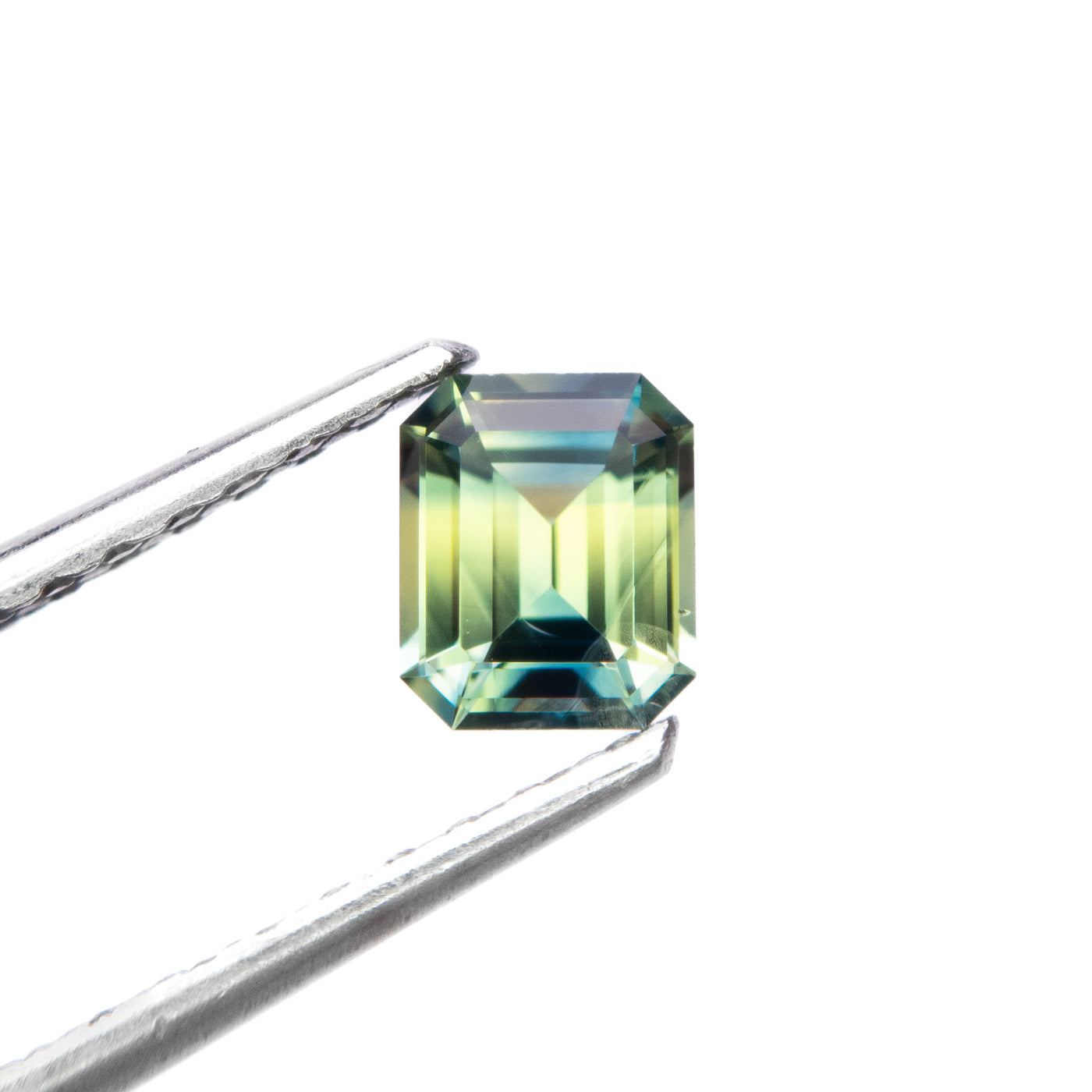 0.69ct Green Teal Parti Emerald Cut Sapphire