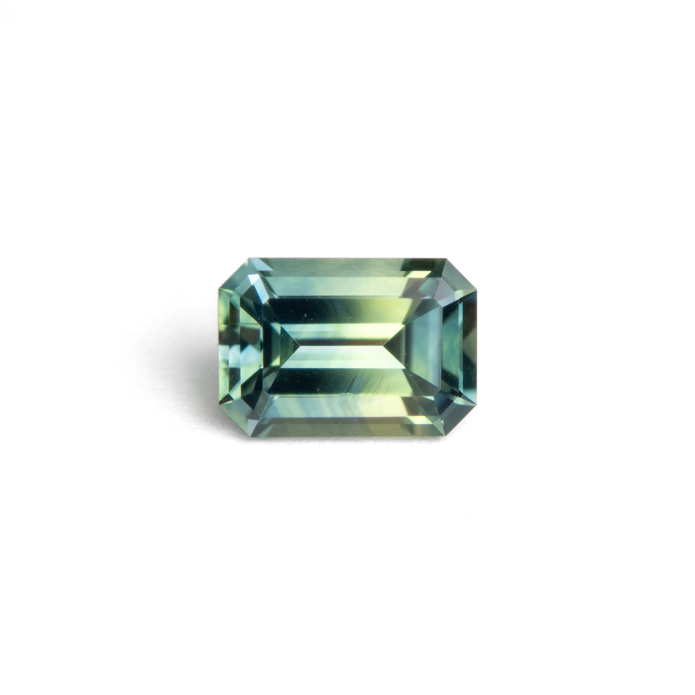 0.80ct Teal Yellow Bi-Colour Emerald Cut Sapphire