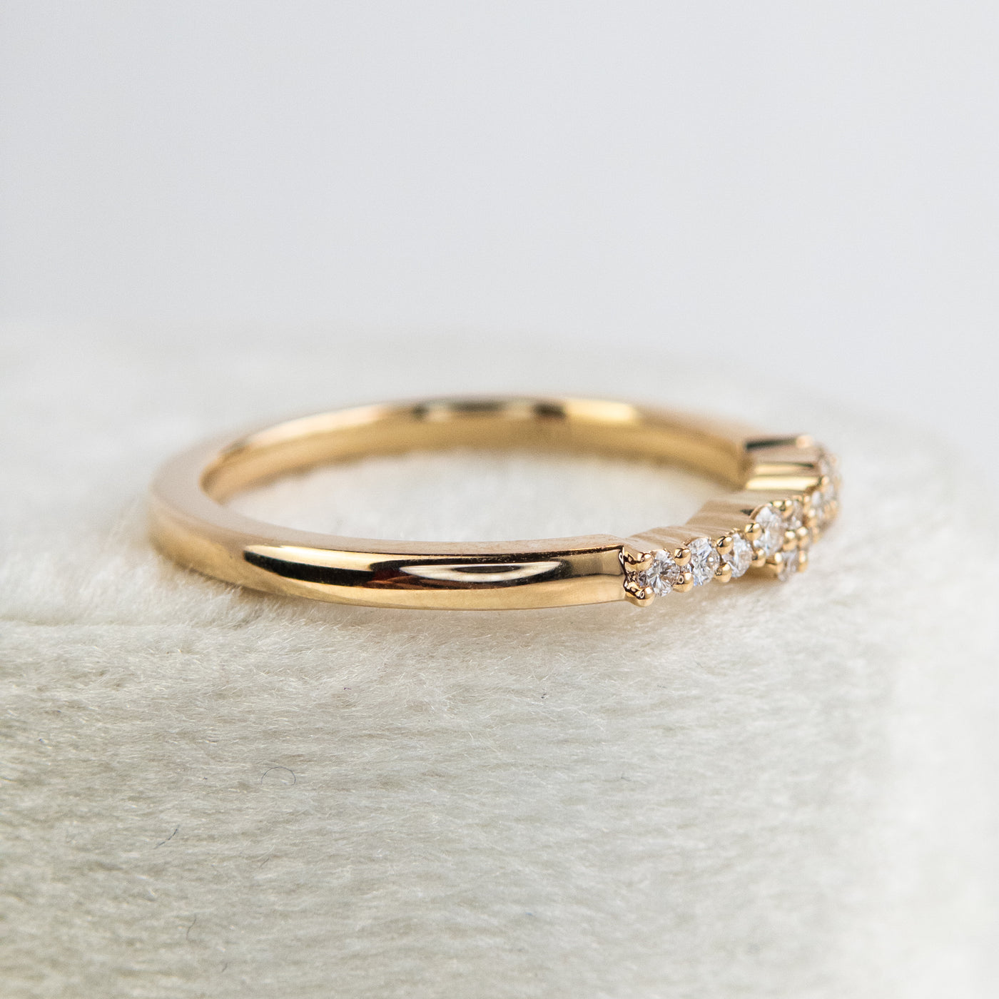 An exquisite gold ring embellished with diamonds, reflecting a timeless elegance and opulence.