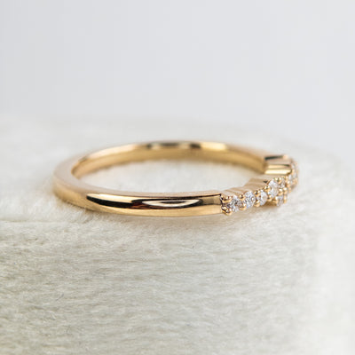 An exquisite gold ring embellished with diamonds, reflecting a timeless elegance and opulence.