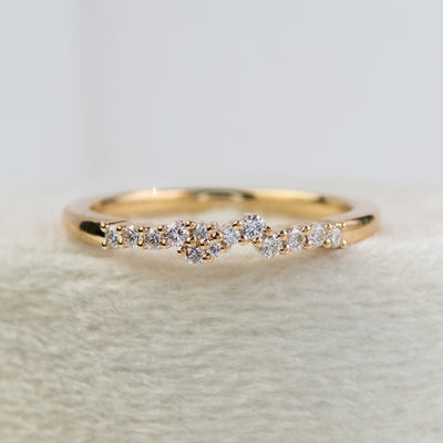 An exquisite gold ring embellished with diamonds, reflecting a timeless elegance and opulence.