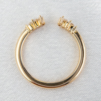 A unique 14KT yellow gold open ring with a combination of Round and Marquise Diamonds, shown from above.