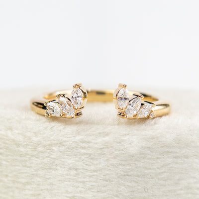 A unique 14KT yellow gold open ring with a combination of Round and Marquise Diamonds. 