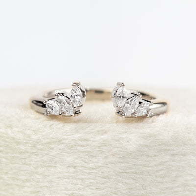 A unique white gold open ring with a combination of Round and Marquise Diamonds.
