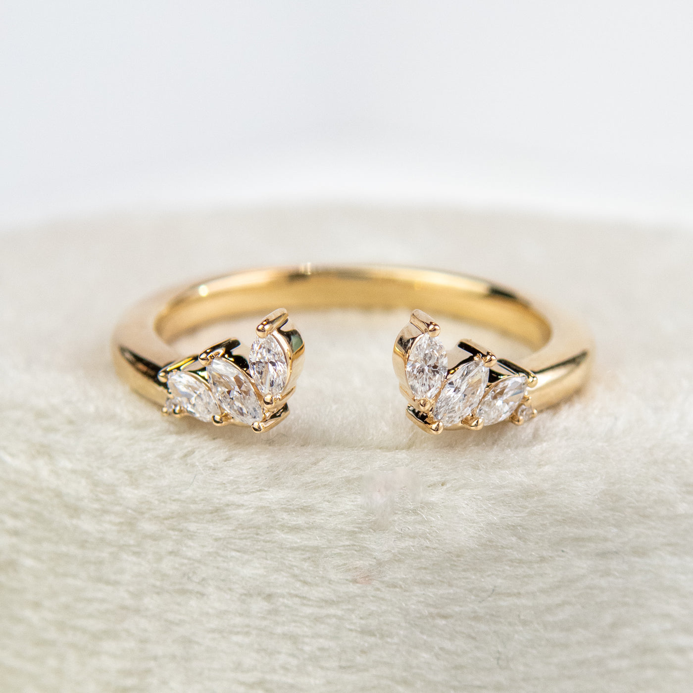 A unique 14KT yellow gold open ring with a combination of Round and Marquise Diamonds. 
