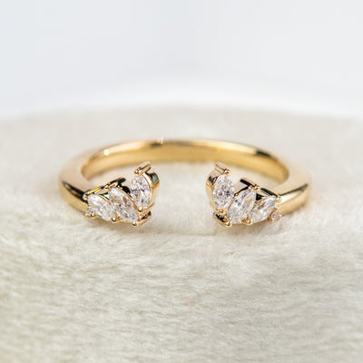 A unique 14KT yellow gold open ring with a combination of Round and Marquise Diamonds. 