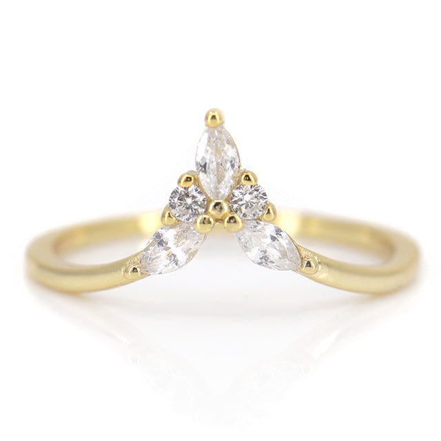 Elegant gold ring featuring a unique design with marquise and round diamonds in a symmetrical arrangement.