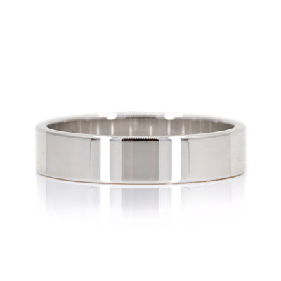 A white gold flat wedding band - elegant and simple.